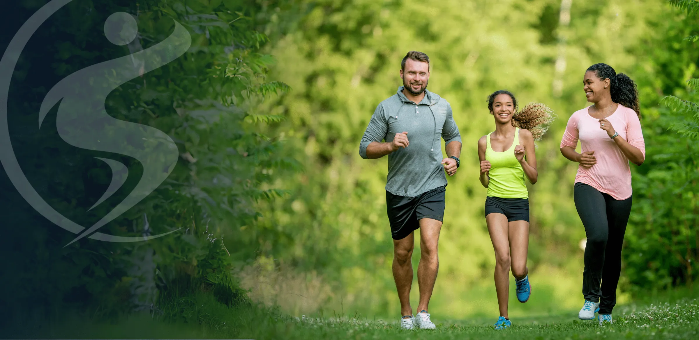 Group of fit individuals jogging outdoors