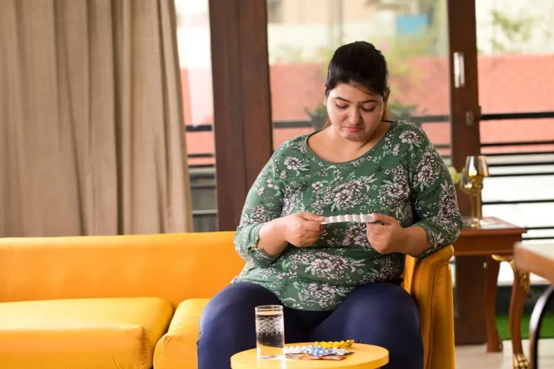 Woman sitting on sofa