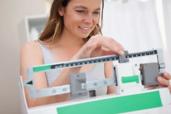 Woman looking at scale