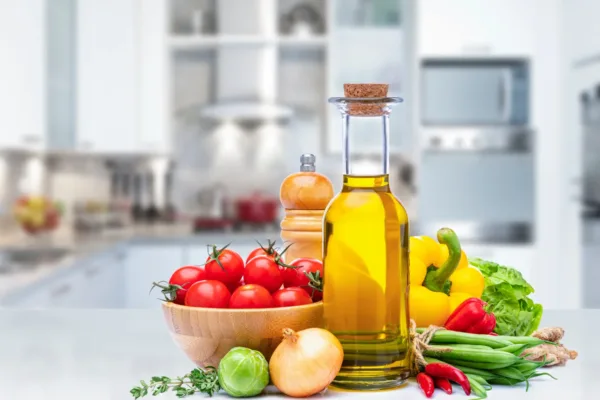 Various vegetables and oils on a kitchen counter