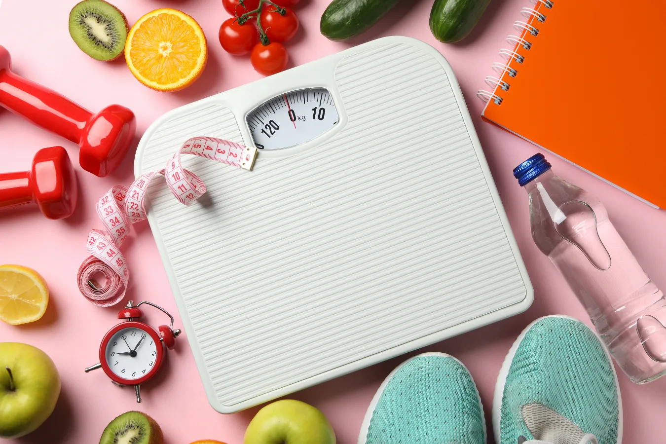 Weigh scale with foods and healthy items around it