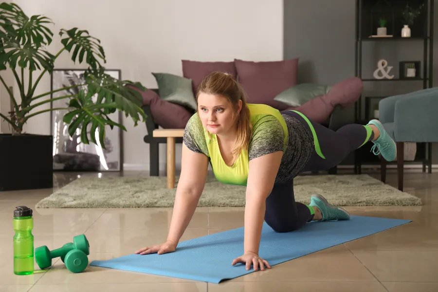 Woman exercising on a mat